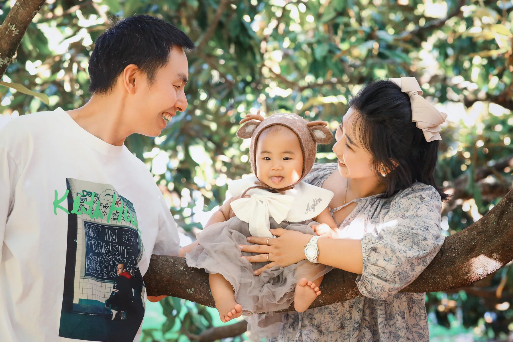 Parents holding their young child